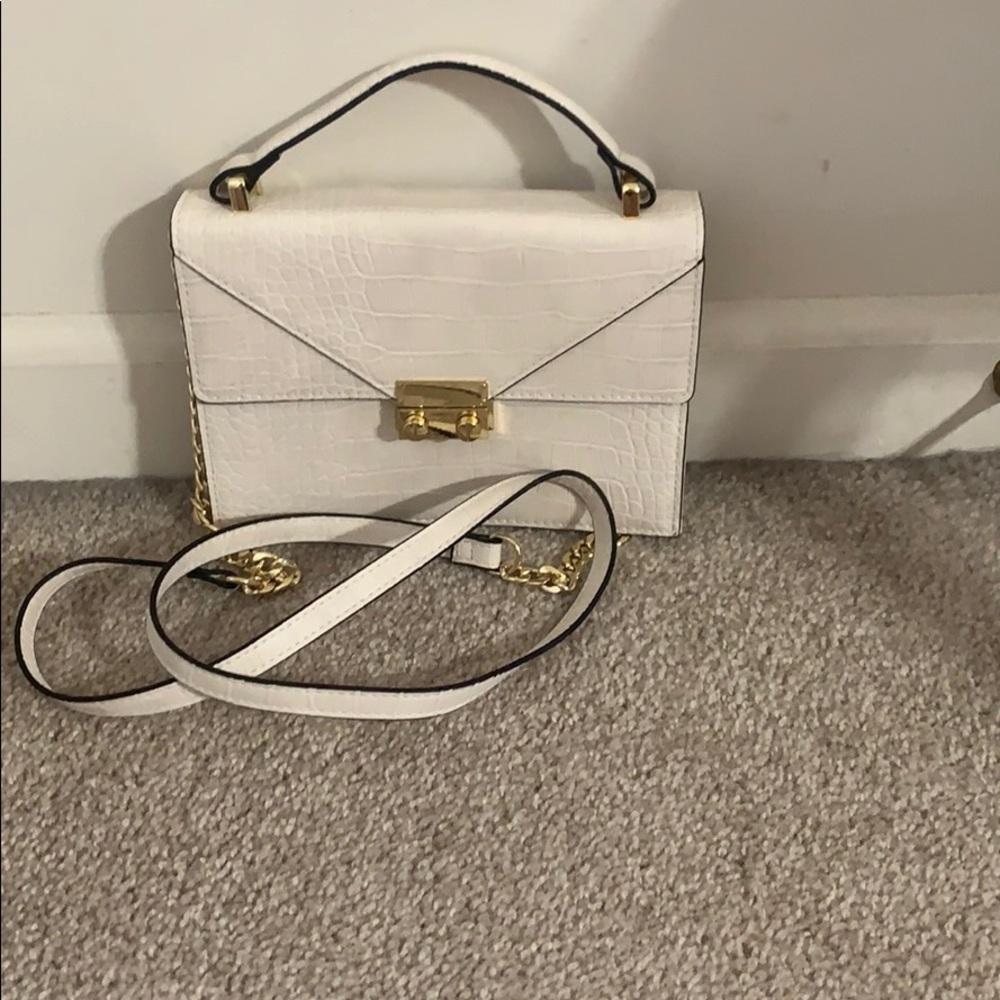 White express crossbody with gold detailing